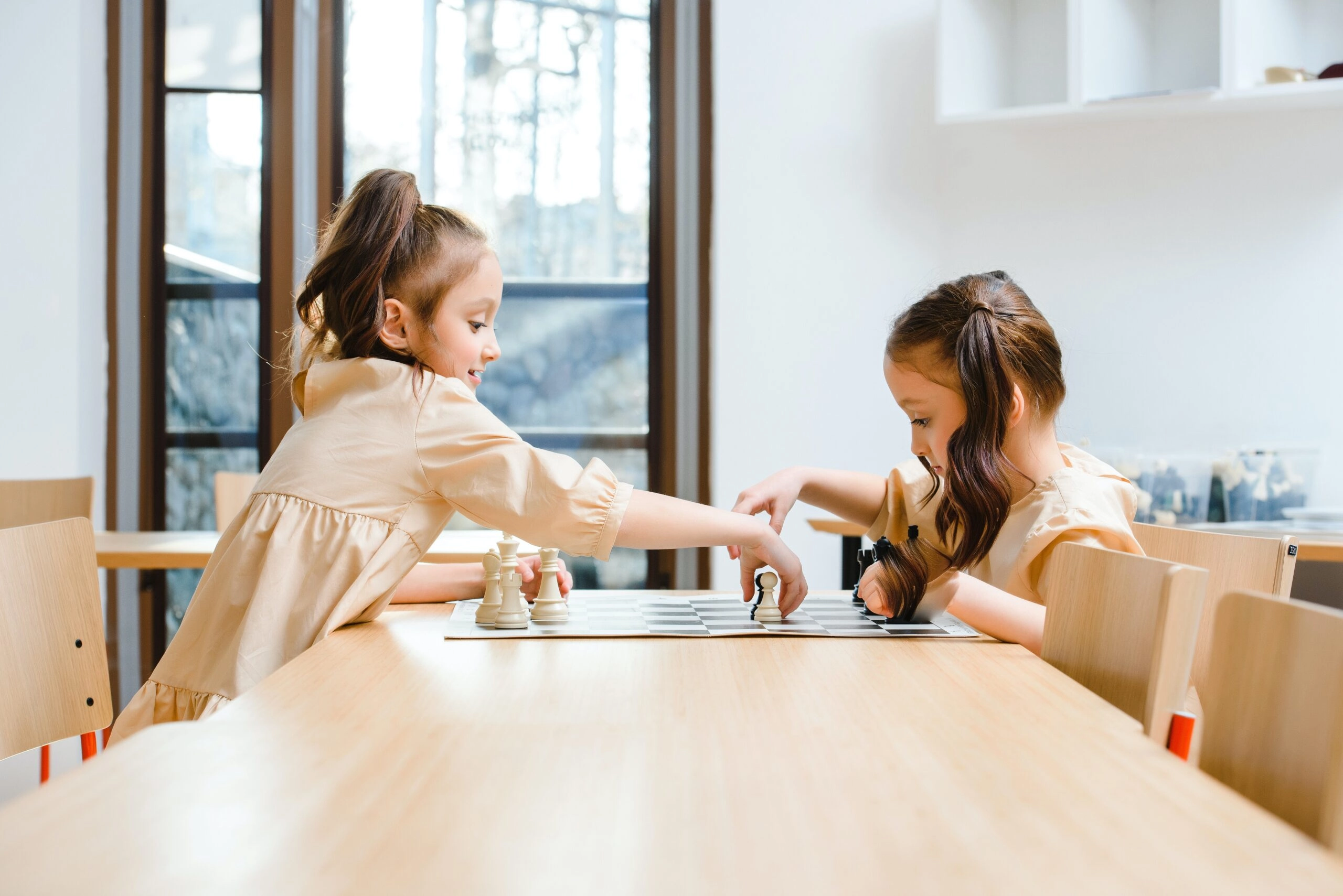 young girls playing chess