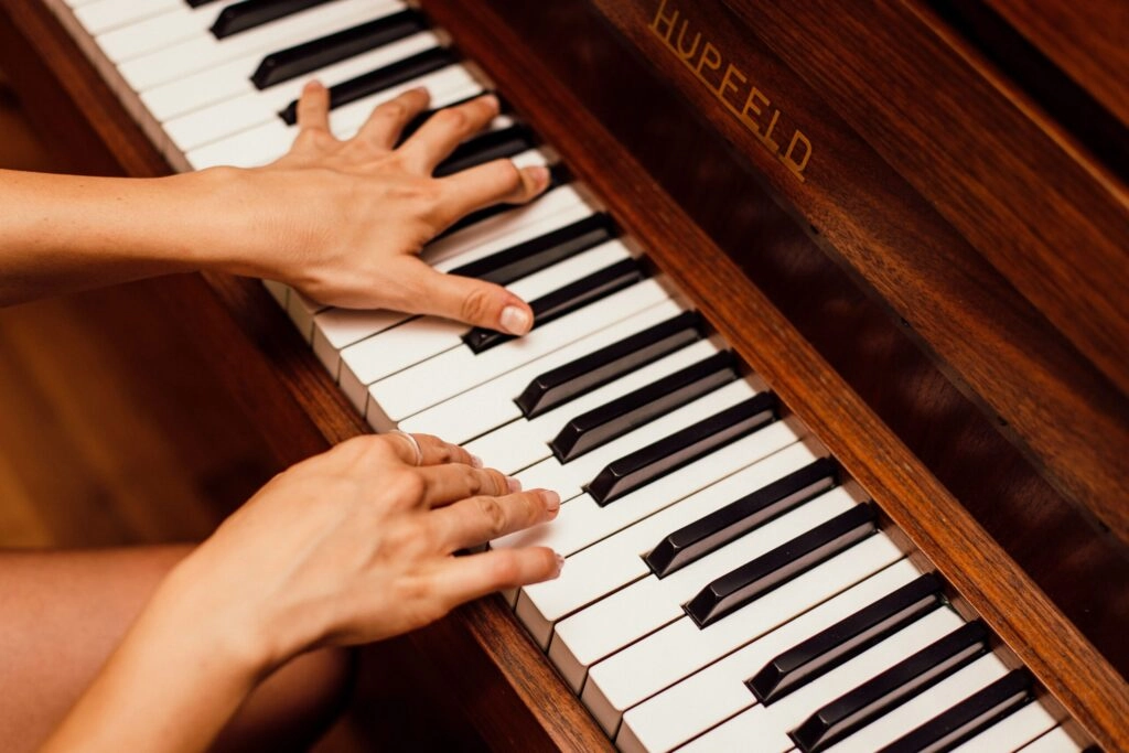 playing piano with both hands