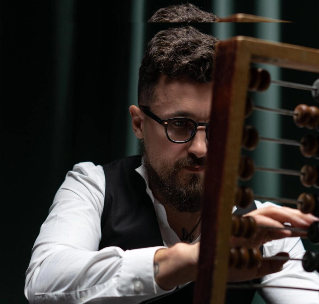 man concentrating on abacus