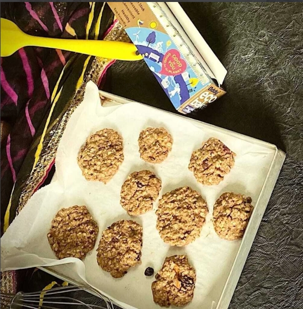 Close-up of freshly baked whole wheat oat cookies on a baking tray